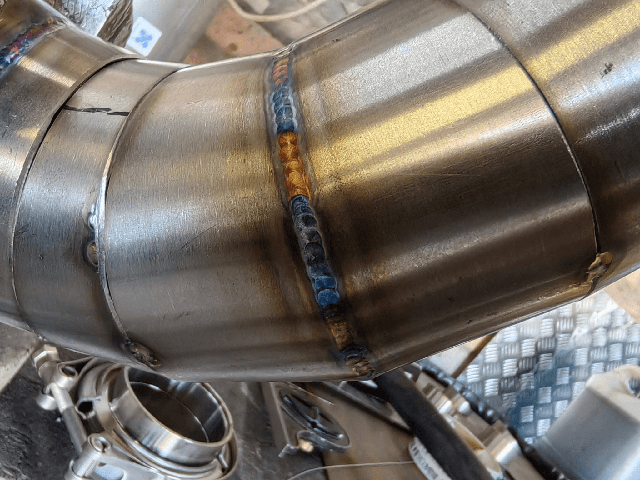 Close view of a finished TIG weld on stainless pipework
